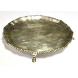 HARRODS FOOTED SILVER SALVER The salver with scalloped border and beaded rim on four hoof feet