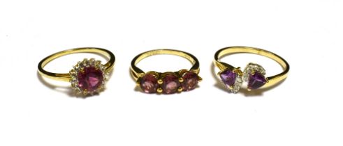 THREE 9CT GOLD GEM SET DRESS RINGS ( Red,pink and purple) Ring sizes N, S, U. Total weight 7g