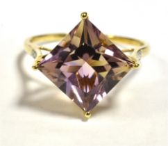 10KT AMETHYST COCKTAIL RING The faceted lozenge cut amethyst measuring 15 x 15mm with diamond accent