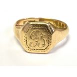 9CT GOLD SIGNET RING WITH MONOGRAMMED INITIAL To the bezel. Ring size Q1/2, weight 6g