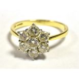 DIAMOND FLOWER HEAD RING The Flower head set with seven round cut diamonds each measuring approx 3mm