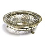 FOOTED PIERCED SILVER BOWL The bowl on three claw feet measuring 20.5cm in diameter and 6cm tall.