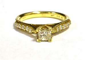 ILIANA 18K DIAMOND DRESS RING The Central princess cut diamond measuring approx 4.5mm, round cut