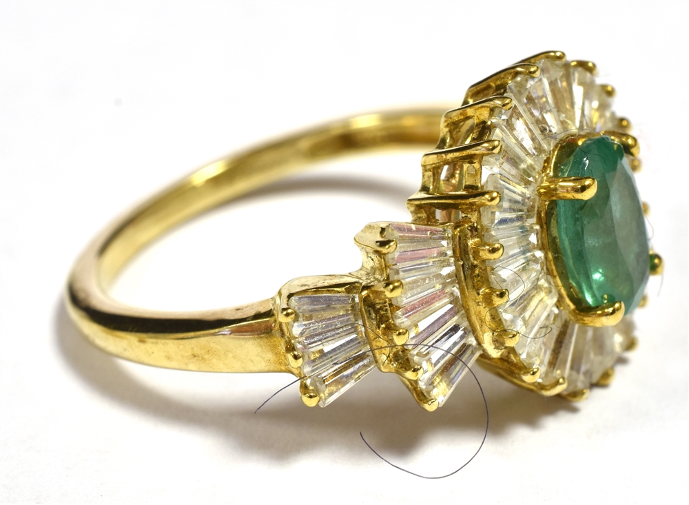 9CT GOLD EMERALD CLUSTER RING The faceted Oval Emerald measuring 7 x 5mm in a clear stone accent - Image 2 of 2