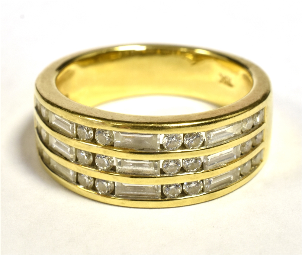 ILIANA 18K TRIPLE DIAMOND ROW HALF ETERNITY RING. The tapered band measuring 8mm in diameter at