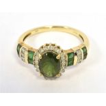 9K GEM SET COCKTAIL RING the ring set with dark green stones with clear accents, ring size P, weight