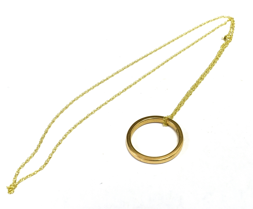 9CT GOLD BAND RING Together with a trace link chain stamped 9CT. The band ring hallmarked Birmingham