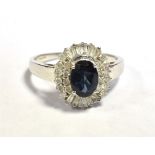 14K WHITE GOLD CLUSTER RING The Cluster in blue and clear gems measuring 12 x 11mm approx. Ring size