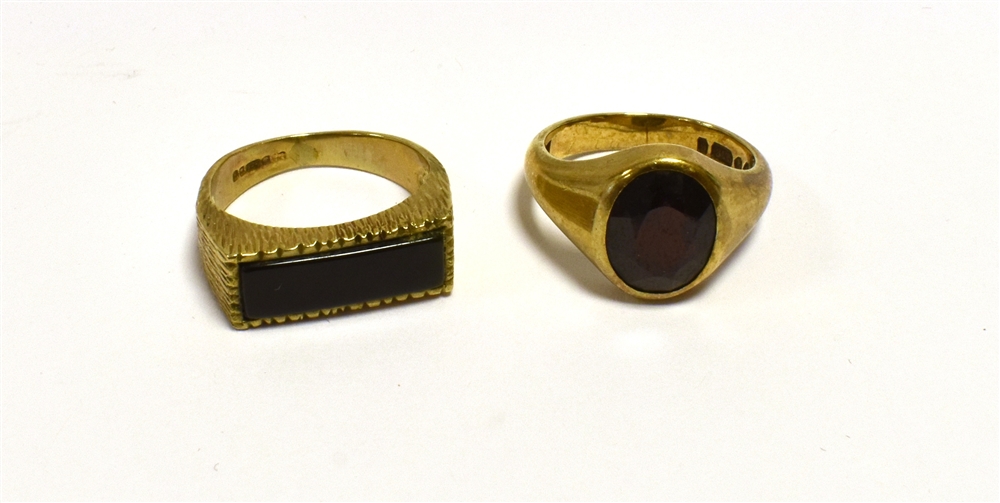 9CT GOLD GYSPY SET RINGS One oval pyrope garnet, approx 10.0 x 5.0mm, hallmarked 375 London 1968.