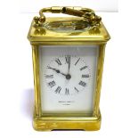 BRASS CARRIAGE CLOCK Retailed by Howell & James Ltd, London, stands 12cm tall, with five bevelled