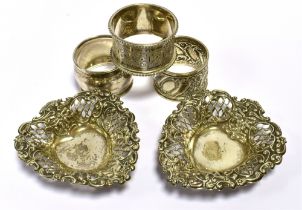 VARIOUS ANTIQUE SILVER ITEMS To include one Victorian and two Edwardian napkins rings, also two
