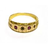 15CT GOLD RUBY & DIAMOND GYPSY SET RING Set with alternating senaille cut diamonds (two are missing)