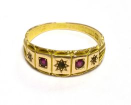 15CT GOLD RUBY & DIAMOND GYPSY SET RING Set with alternating senaille cut diamonds (two are missing)