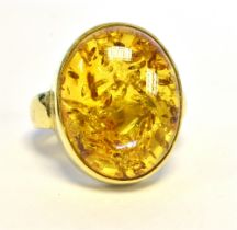 18CT GOLD BALTIC AMBER RING 17.3 X 13.8mm oval Baltic amber cabochon, bezel set in 18ct gold,