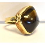 9CT GOLD TIGERS EYE DRESS RING Bezel set tiger's eye cabochon, approx 17.1 x 16.7mm, ring size F,