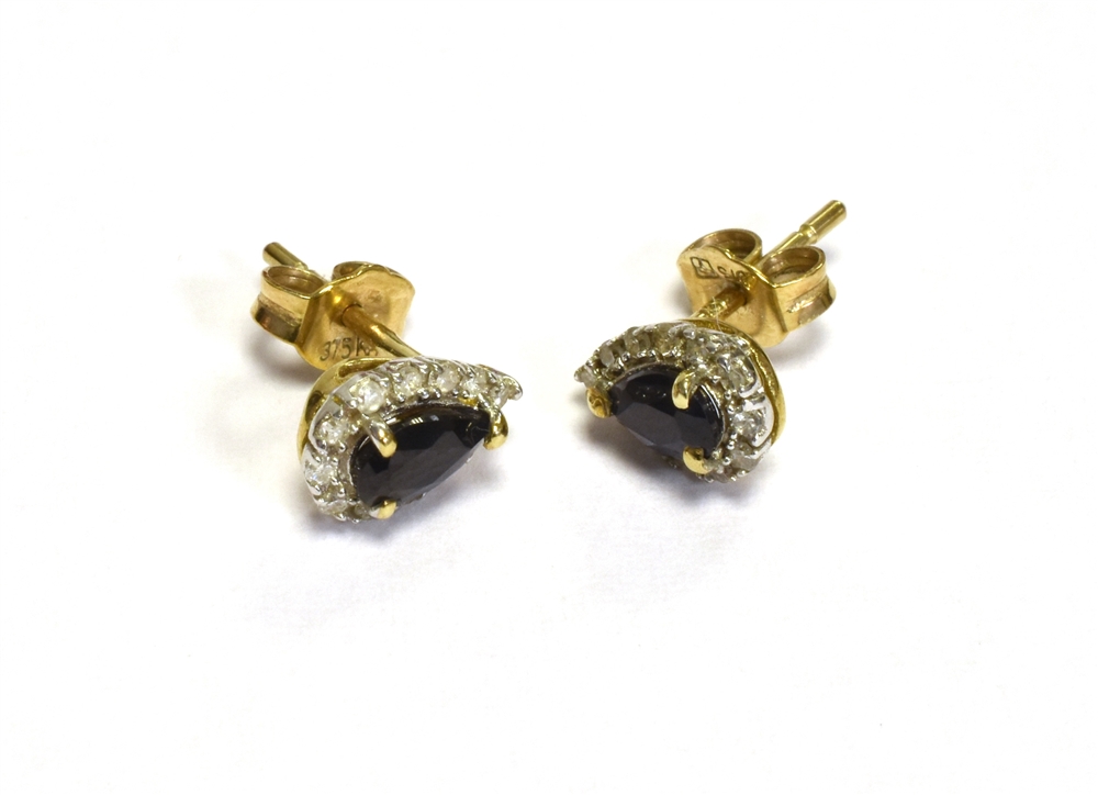 SAPPHIRE & DIAMOND STUD EARRINGS Set in 9 carat gold, pear shaped sapphires surrounded by a halo