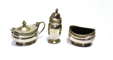 STERLING SILVER CONDIMENT SET To include mustard, salt and pepper pots, with spoon and blue glass