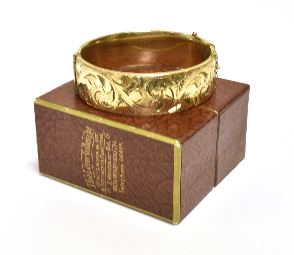 9CT GOLD METAL CORE BANGLE 18.7mm wide with foliate and scroll engraving to front, stamped '1/5th - Image 2 of 2
