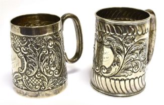EDWARDIAN SILVER CHRISTENING MUGS Embossed with floral and foliate motifs, monogrammed 'Louie'