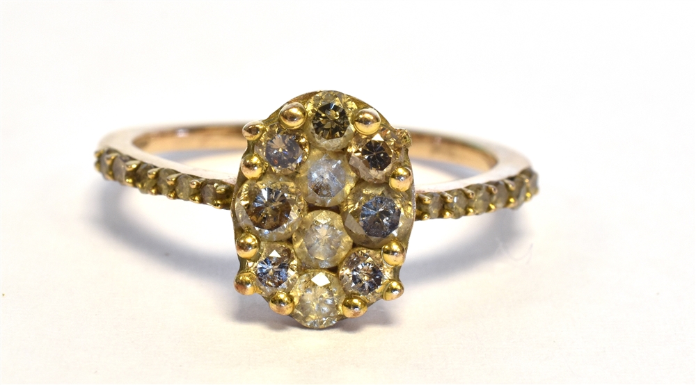 ARGYLE CHAMPAGNE DIAMOND RING Oval grain set head with round brilliant cut 'champagne' diamonds