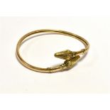 ANTIQUE 9CT GOLD TORQUE BANGLE Wrap around torque style bangle, 3.5mm wide, with lotus bud and