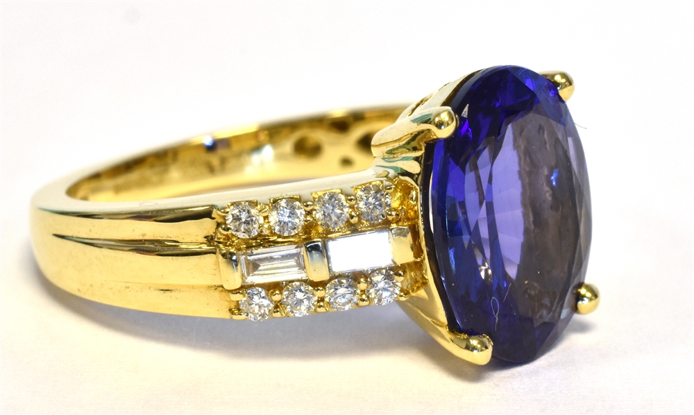 TANZANITE & DIAMOND DRESS RING Vivid oval tanzanite, approx 12.1 x 8.9mm, flanked by round brilliant - Image 2 of 3