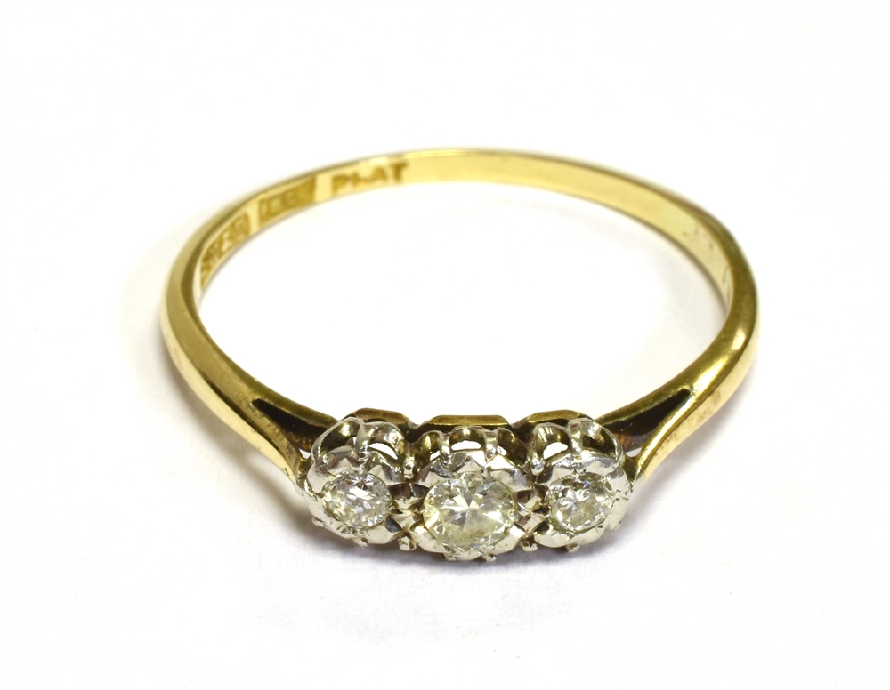 VINTAGE THREE STONE DIAMOND RING Three brilliant cut diamonds, of good quality, illusion set in