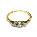 VINTAGE THREE STONE DIAMOND RING Three brilliant cut diamonds, of good quality, illusion set in