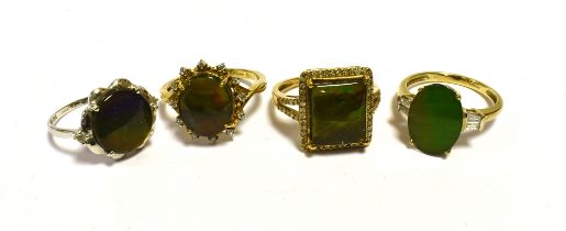9CT GOLD DIAMOND & AMMOLITE RINGS One rectangular and one oval ammolite set with diamonds and two
