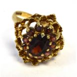 9CT GOLD & GARNET DRESS RING 19.0 x 17.2mm open work cluster head, set with pyrope and almandine