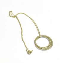 9CT WHITE GOLD DIAMOND SET PENDANT 2.6cm diameter pendant with channel set baguette and grain set