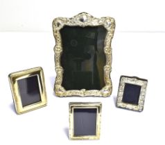 VARIOUS SILVER MOUNTED PICTURE FRAMES To include; one 17.5 x 12cm with heavily embossed frame,