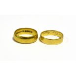 18CT GOLD WEDDING BANDS One 6.4mm wide, ring size S 1/2, hallmarked 18 London 1966. One 5.3mm