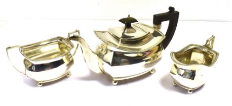 ART DECO SILVER TEA SERVICE Of geometric form with gadrooned edges and classical handles on orb