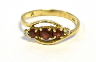 9CT GOLD DIAMOND & GARNET RING 8.1mm wide head, set with round cut pyrope garnets and brilliant