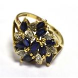9CT GOLD SAPPHIRE & DIAMOND RING 15.5mm claw set swirling cluster ring, set with navette cut