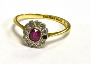 ANTIQUE 18CT RUBY AND DIAMOND HALO RING 9.4 x 9.2mm oval, mille grain set platinum topped head, with