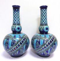 A PAIR OF BURMANTOFTS FAIENCE PARTIE-COLOUR PERSIAN VASES designed by Joseph Walmsley, model no.