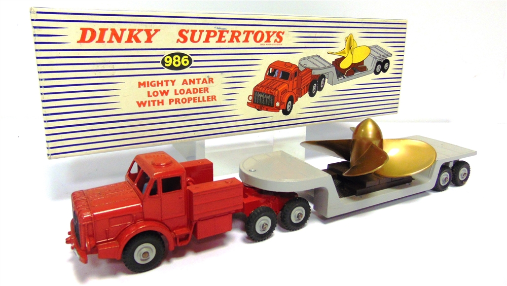 A DINKY NO.986, MIGHTY ANTAR LOW LOADER WITH PROPELLER red and grey, with grey ridged hubs, near