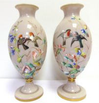 A PAIR OF 19TH CENTURY OPALINE GREY GLASS VASES probably French, painted with birds among brightly