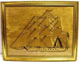 NAUTICALIA - A 19TH CENTURY WOVEN WOOLWORK PICTURE OF A THREE-MASTED ARMED MERCHANT SHIP with
