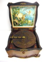 A POLYPHON DISC MUSICAL BOX late 19th century, with a level-wind movement (working), in a walnut