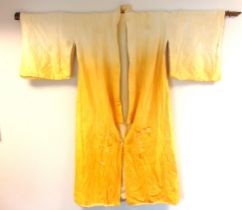 A CHINESE EMBROIDERED CREAM & SHADED GOLDEN YELLOW SILK ROBE mid 20th century, decorated with