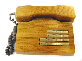 A GFELLER TRUB SOLID WOOD TELEPHONE Swiss, with maker's labels to base, 21cm wide, 19cm deep.