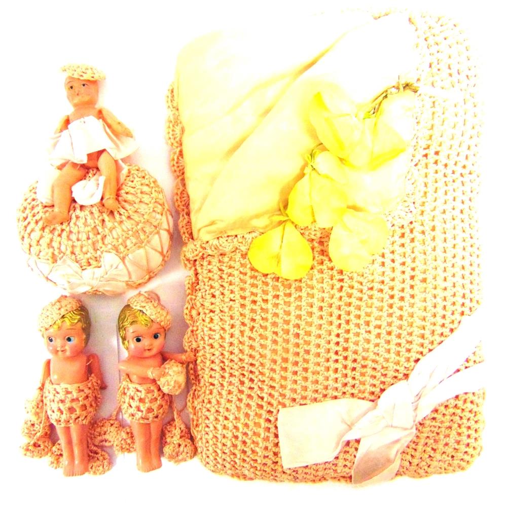 THREE JAPANESE CELLULOID DOLLS circa 1930s, the largest 13.5cm high, together with a padded pyjama