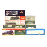 [OO GAUGE]. NINE EMPTY LOCOMOTIVE BOXES comprising those for a Tri-ang Wrenn No.2218, B.R. 4MT 2-6-4