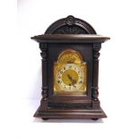 A BRACKET CLOCK early 20th century, the silvered chapter ring with black Arabic numerals, fitted