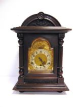 A BRACKET CLOCK early 20th century, the silvered chapter ring with black Arabic numerals, fitted
