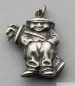 Silver golf pendant /charm in the form of a golfer carrying a golf bag,