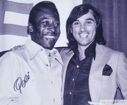 Large black and white photograph of Pele and George Best